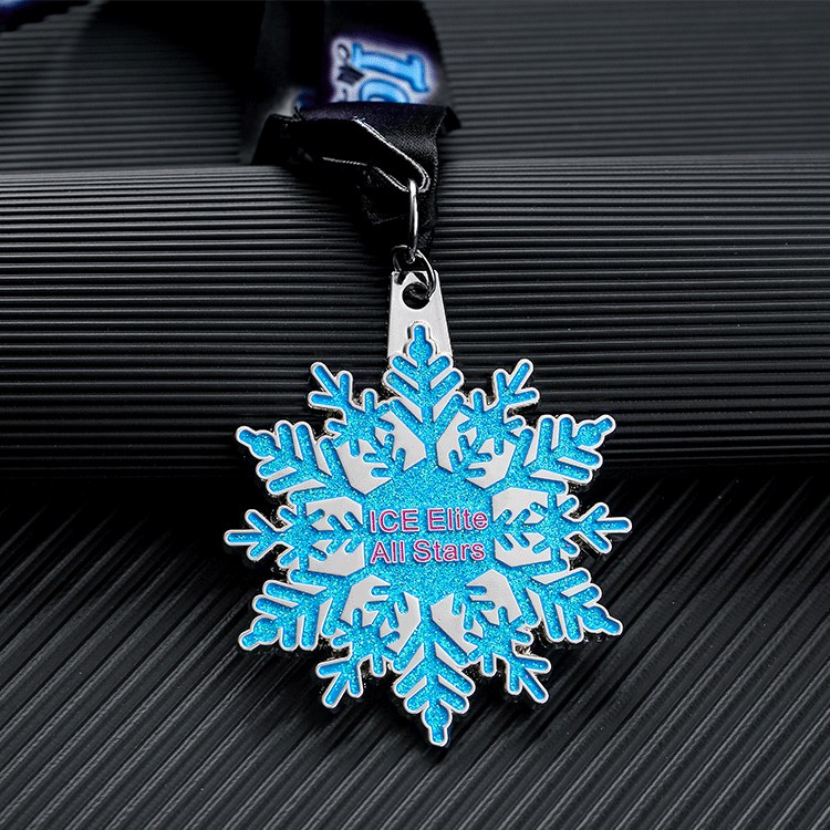 Snowflake - shaped medal for “ICE Elite All Stars”. Blue glitter design, black ribbon.