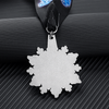 Snowflake - shaped medal for “ICE Elite All Stars”. Blue glitter design, black ribbon.