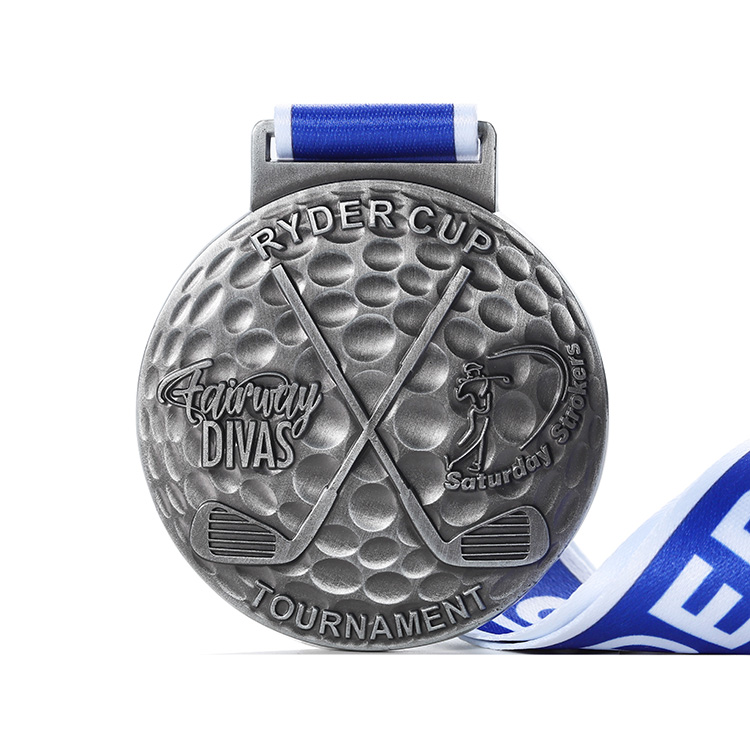 Customizable Low Cost Silver Toned Circular Ryder Cup Golf Medal with Textured Patterns and Blue White Ribbon